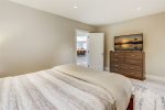Bedroom 2 - Queen bed, smart TV, private half bathroom